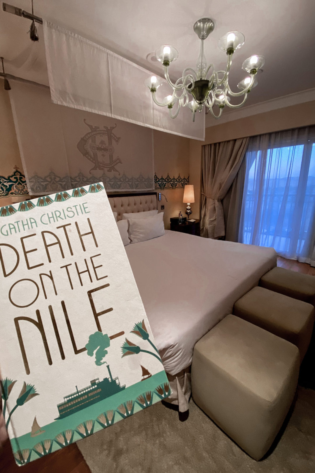 A hardcover of "Death on the Nile" by Agatha Christie inside a luxury room in the Sofitel Legend Old Cataract Hotel in Aswan, Egypt