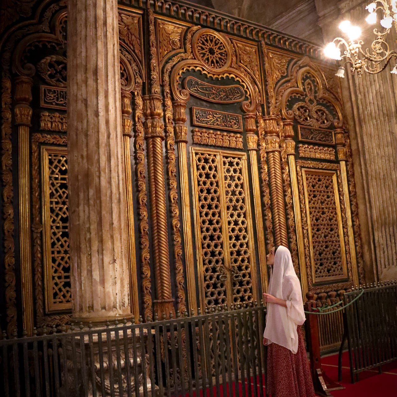 Jordan Gassner looking up at the tomb of Muhammad Ali Pasha in one of the must-see Cairo mosques - the Alabaster Mosque 