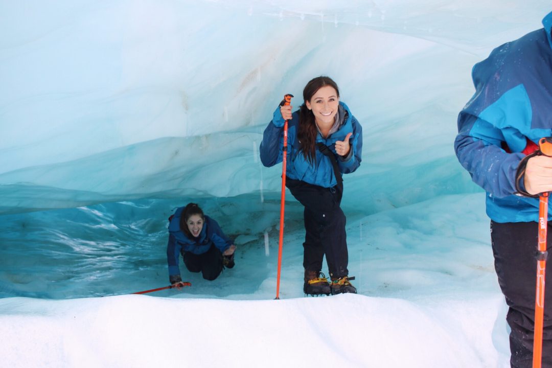 Visiting New Zealand: Travel Blogger, Jordan Gassner, and friend glacial hiking through Franz Josef Glacier in New Zealand