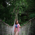 Travel Blogger Jordan Gassner looking out over one of the rope bridges along Inkaterra Reserva Amazonica's Canopy Walkway in the Peruvian Amazon
