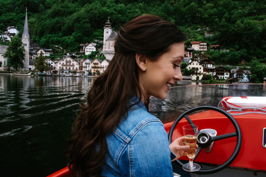 Jordan Gassner driving an electric boat through Hallstatt, Austria