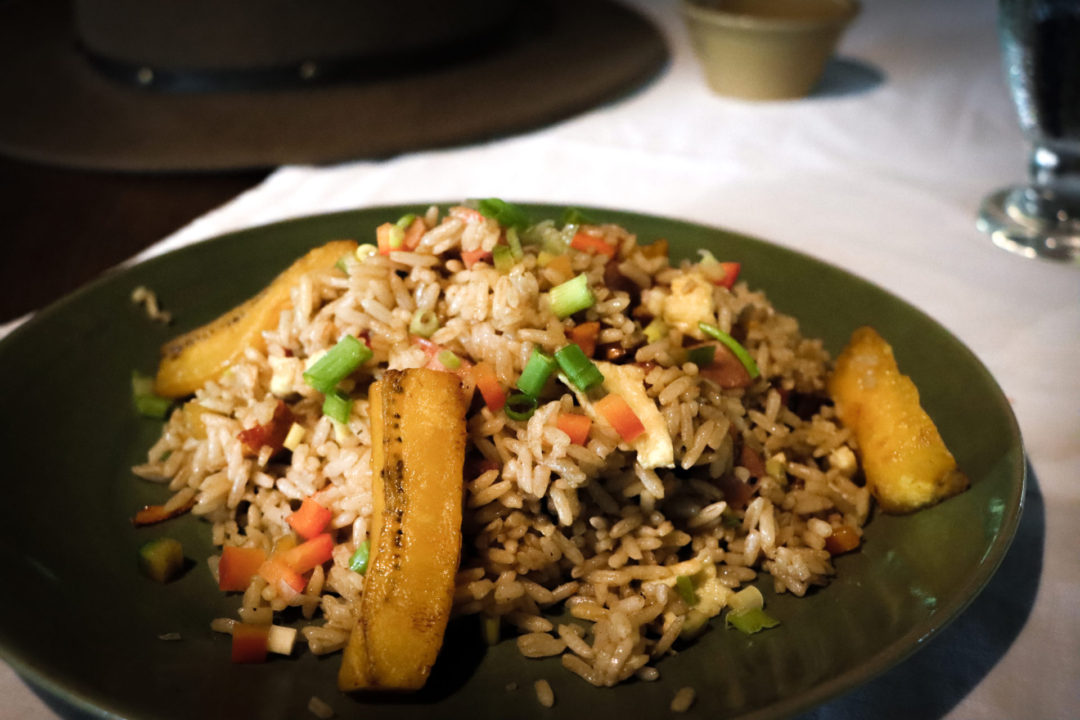 Traditional Chaufa dish with Fried Plantains served on a green dish at Inkaterra Reserva Amazonica in Puerto Maldonado, Peru