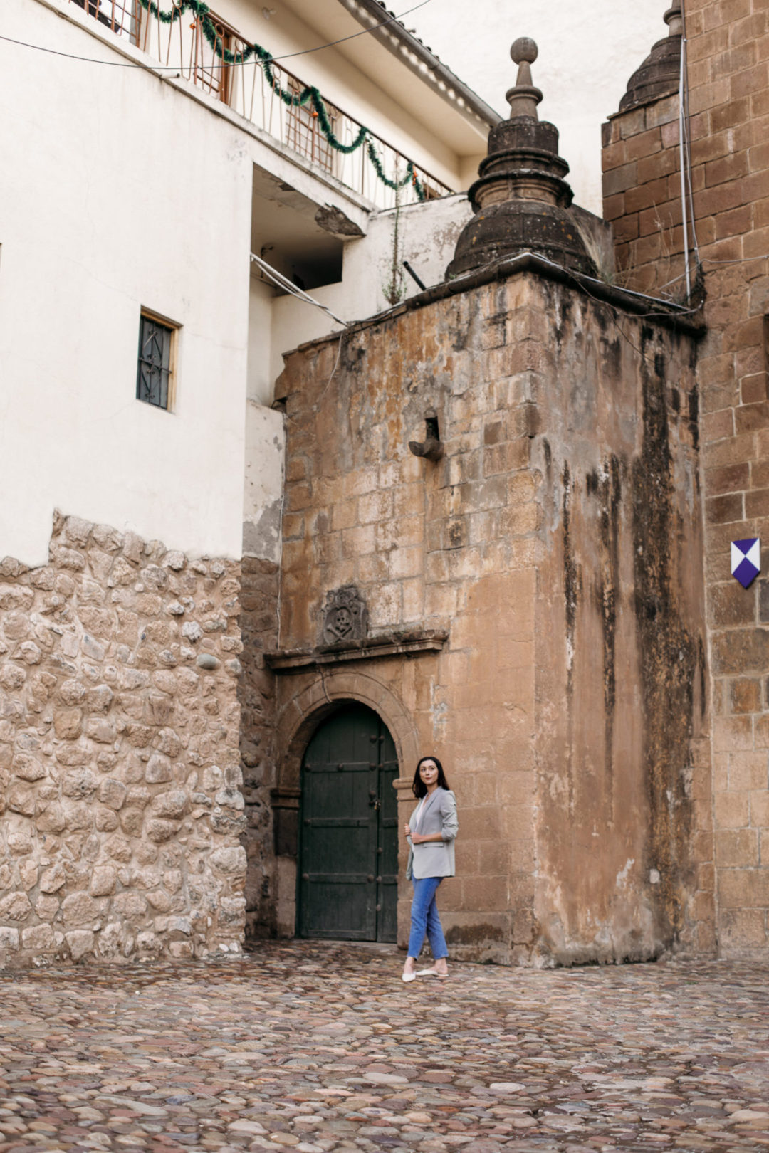 Jordan Gassner looking around the entrance of the Main Cathedral in Cusco's Plaza de Armas