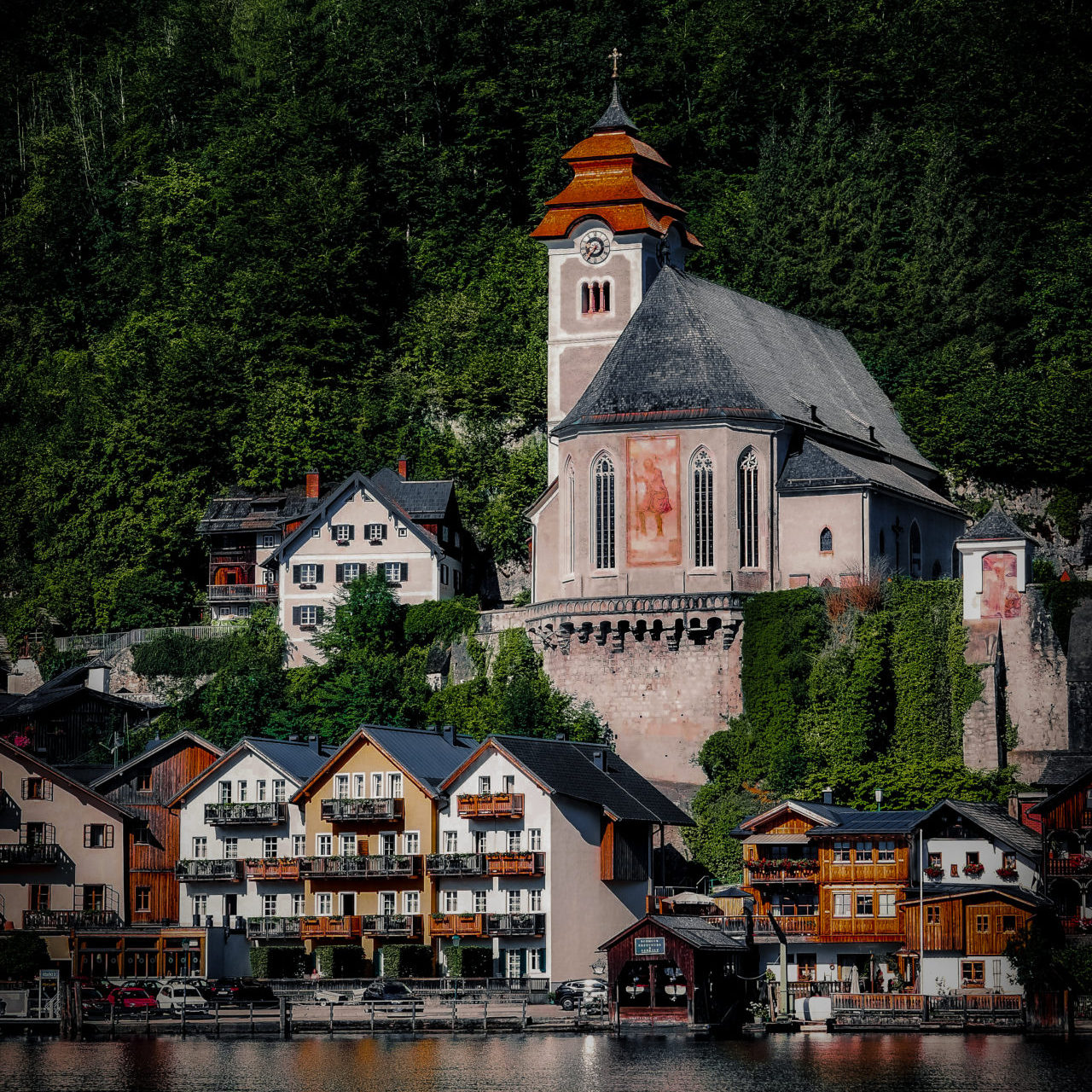 View from the lake of St. Michael's Chapel in Hallstatt Village in Austria