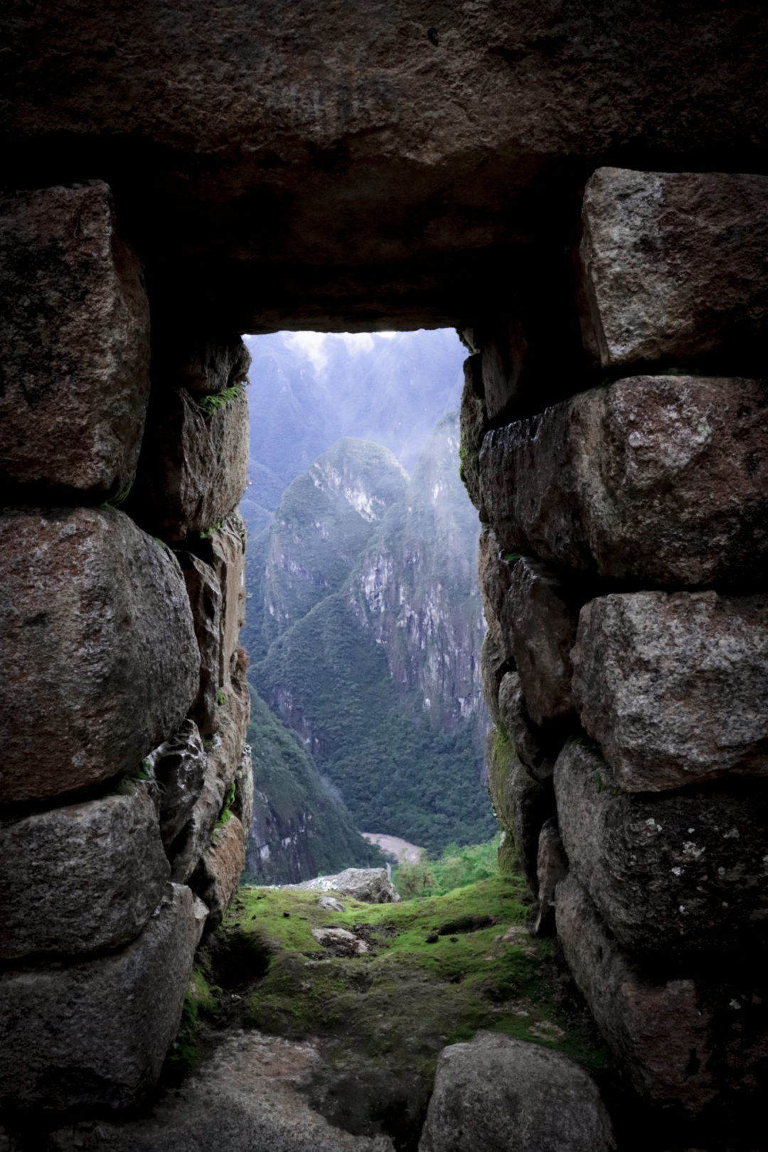 A view from a Inca window looking out over the deep Machu Picchu valley and Urubamba River 