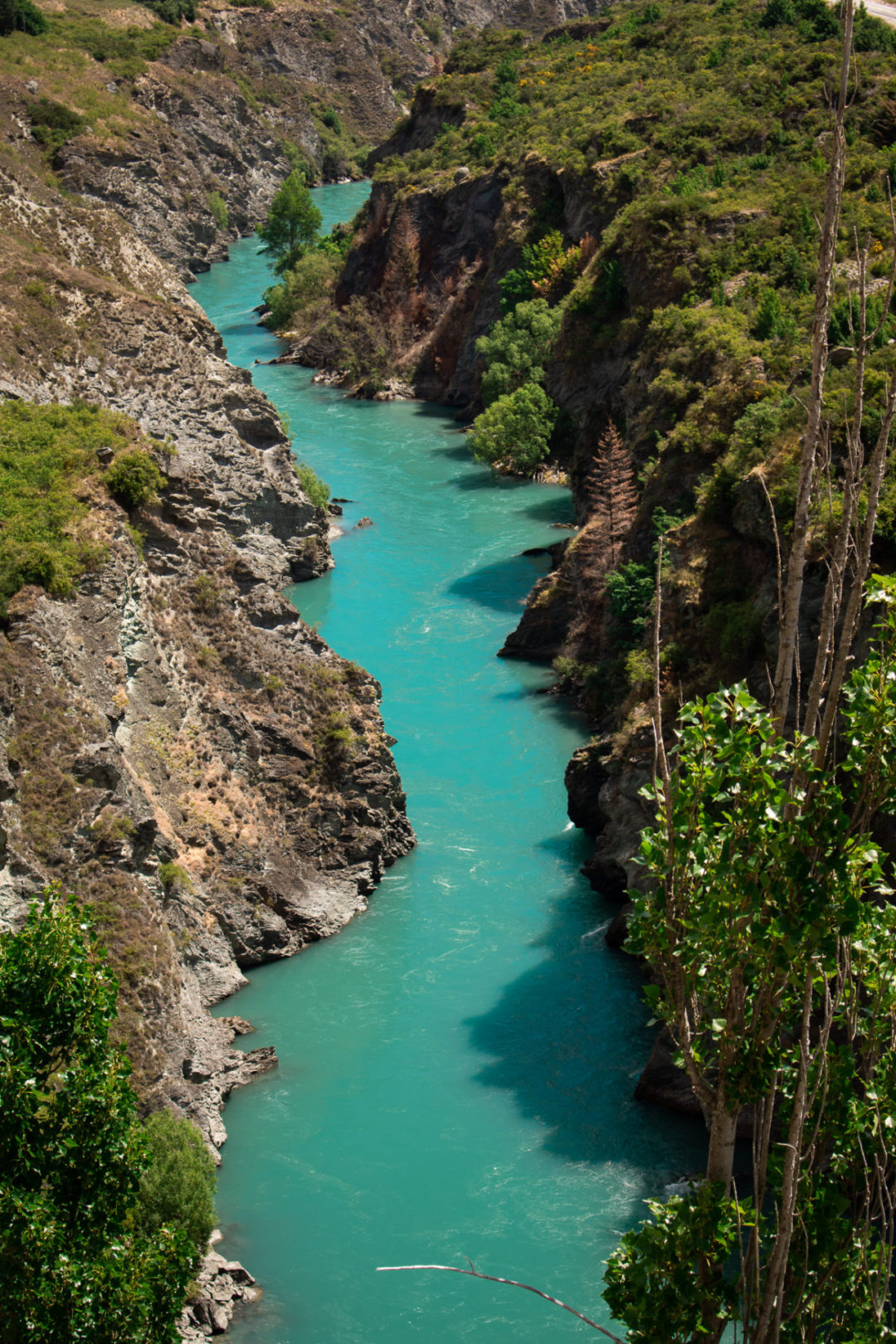 Visiting New Zealand: An overhead view of the Turquoise Waters of Shotover Canyon River just outside of Queenstown, New Zealand