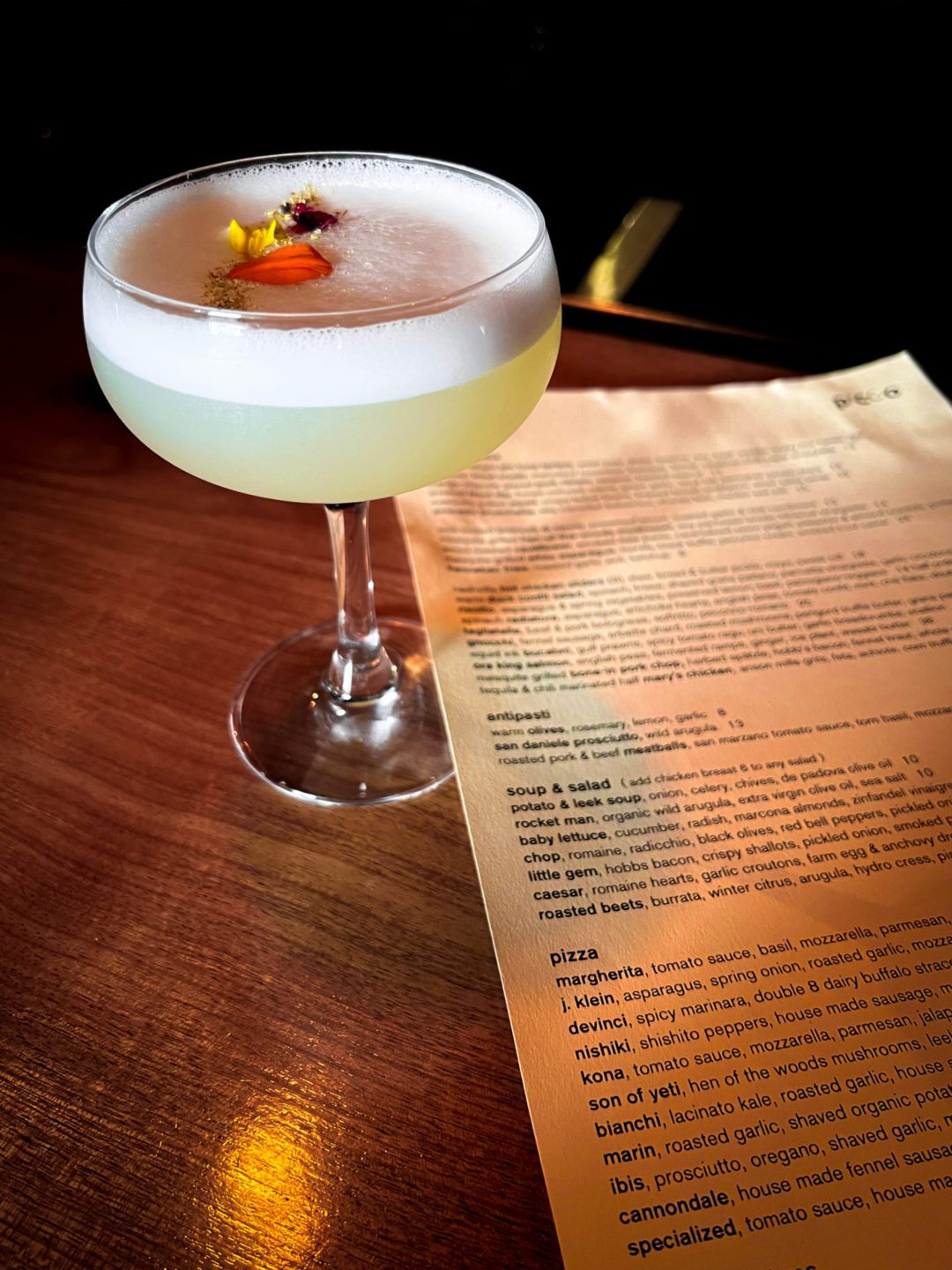 The Forever Young Cocktail topped with flowers from Picco in Larkspur, a one of the best restaurants in Marin County