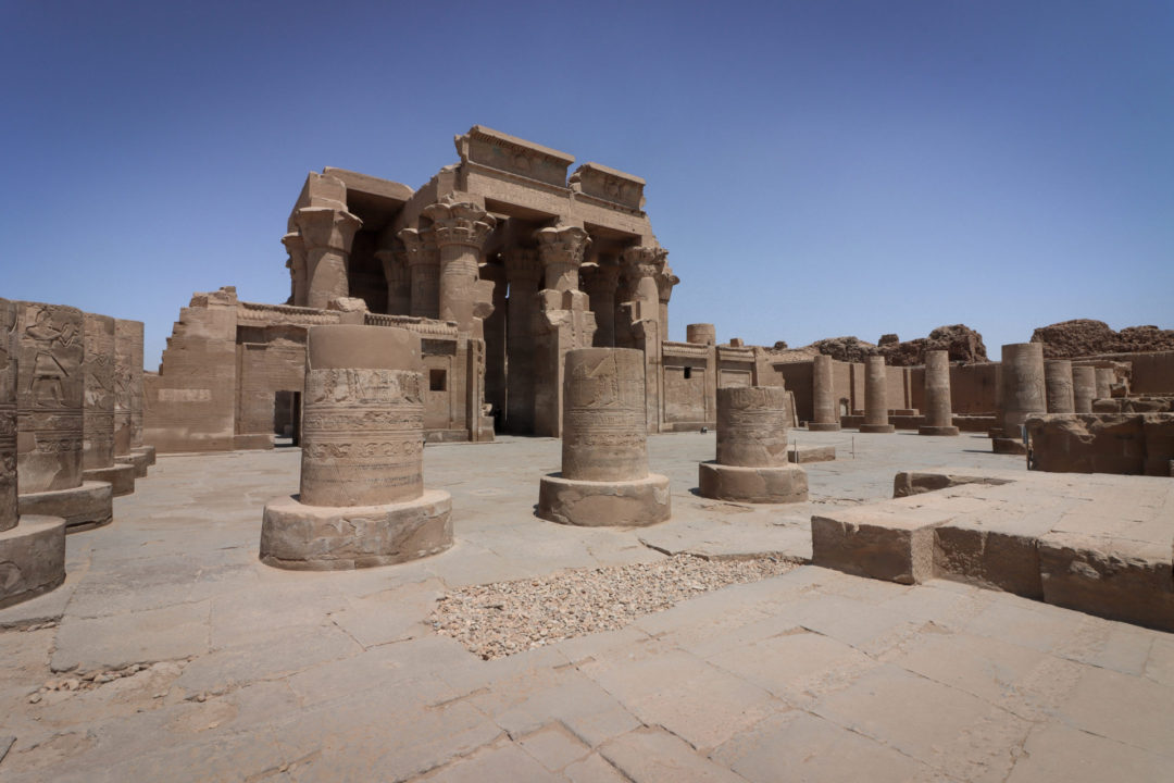The empty ruins of Kom Ombo Temple on a clear blue day in Egypt.