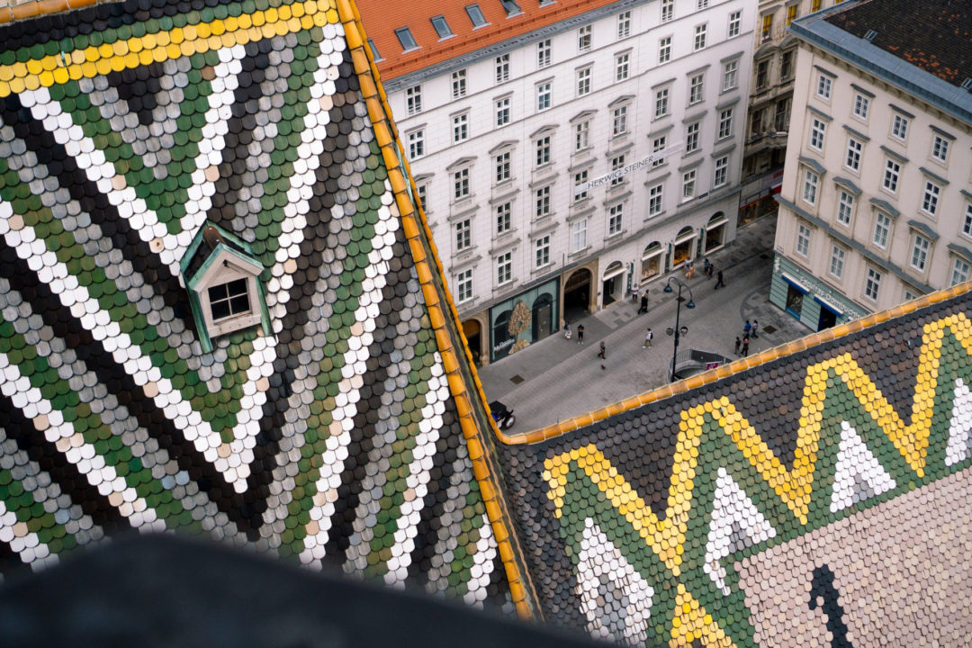 Vienna Travel Guide: Green, White, Grey and Black Chevron Tiles line the rooftop of St. Stephen's Cathedral in Vienna, Austria's City Center