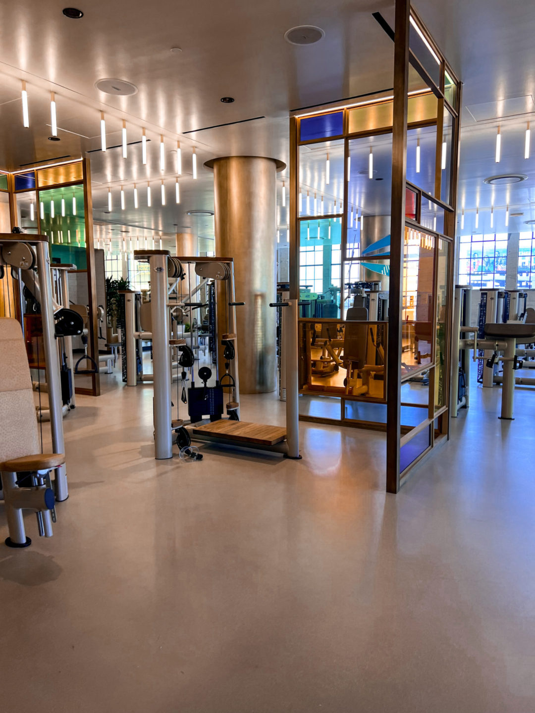 New gold workout machines and stained glass interior design inside Heimat Club in Los Angeles, California