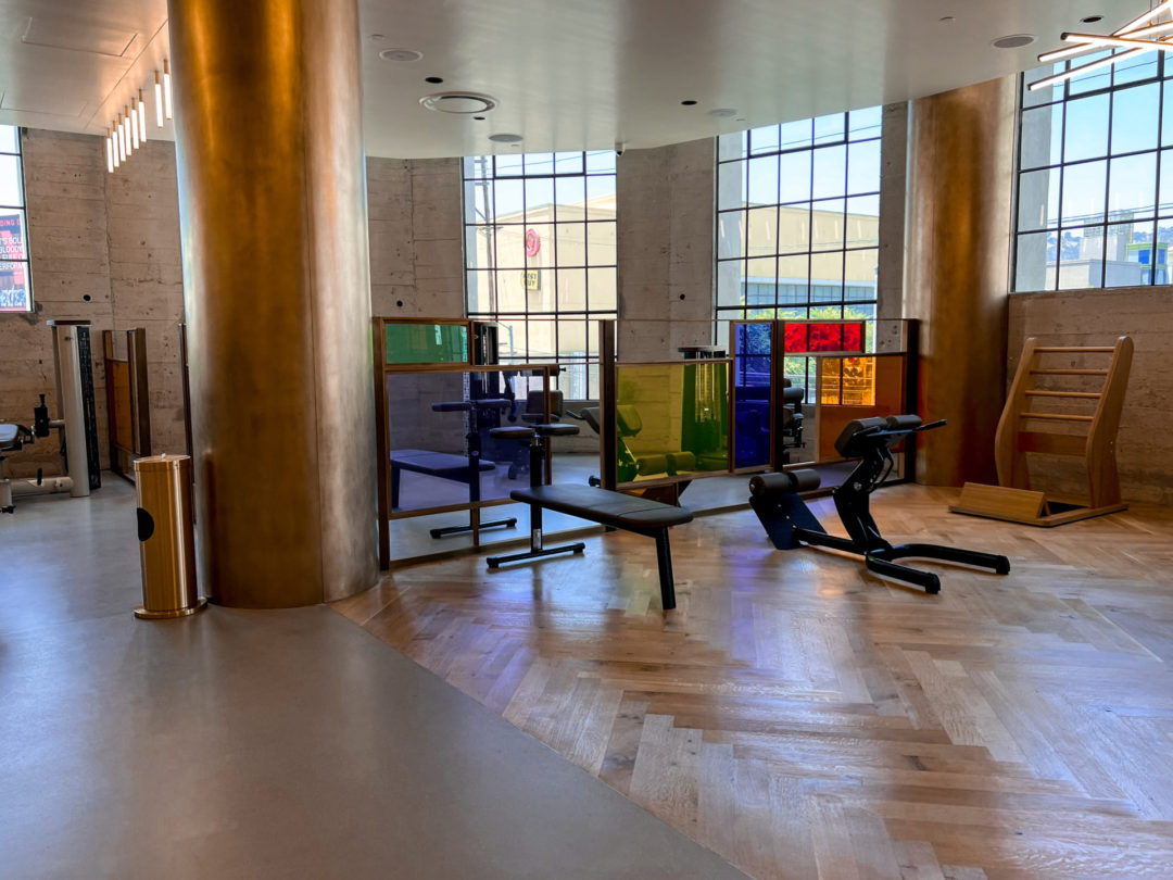 Abdominal machines on a wooden floor in a large workout space inside Heimat in Los Angeles, California, USA