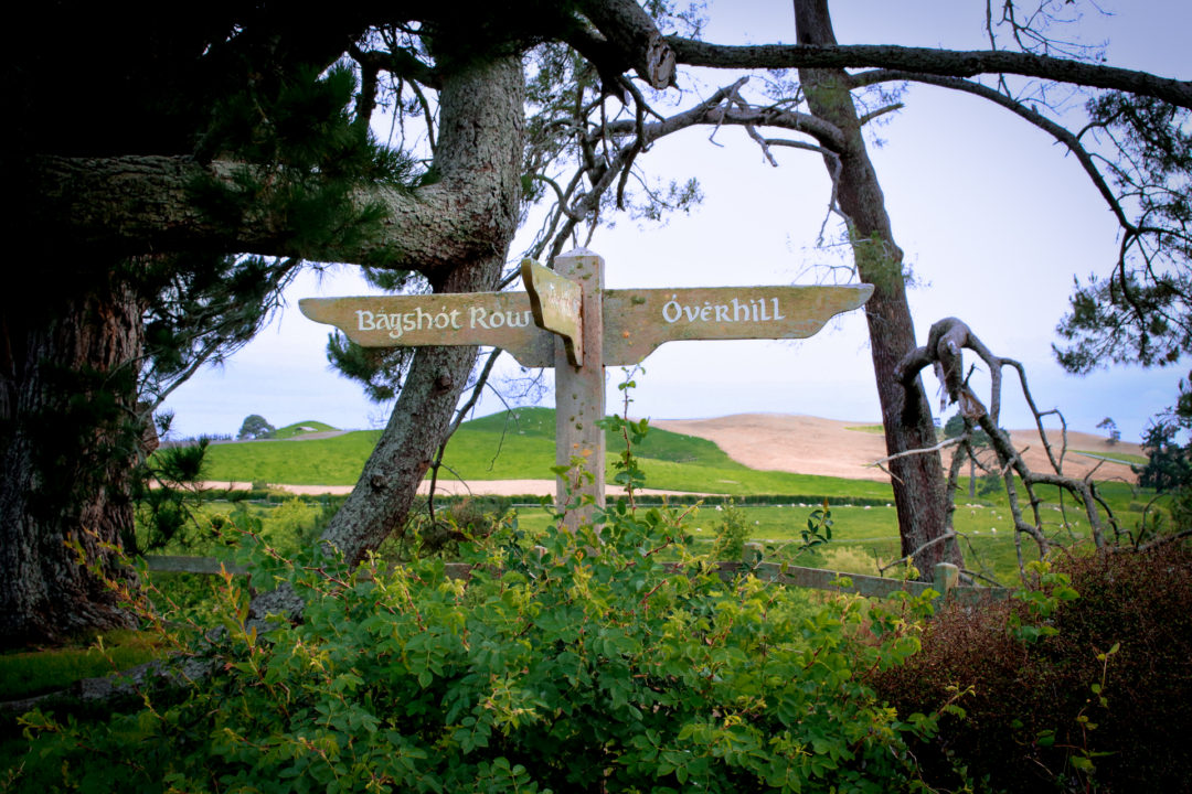 A directional sign reading "Bagshot Row" on one side and "Overhill" on the other side in Hobbiton New Zealand