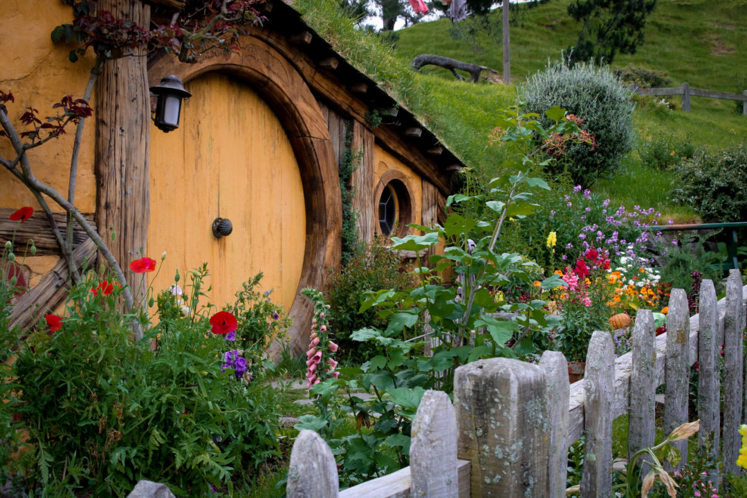 A Yellow-Painted Hobbit Hole Door in Hobbiton New Zealand