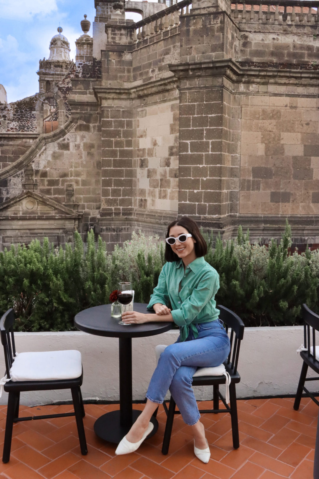 Travel Blogger Jordan Gassner enjoying a glass of red wine on the the Círculo Mexicano Boutique hotel Rooftop in El Centro, CDMX, Mexico