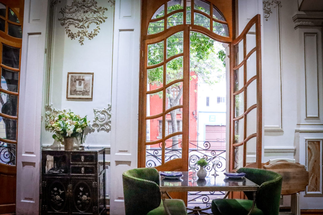 Where to drink the best natural wine: Galanga Thai Restaurant's green and white interior colonial dining room in Mexico City