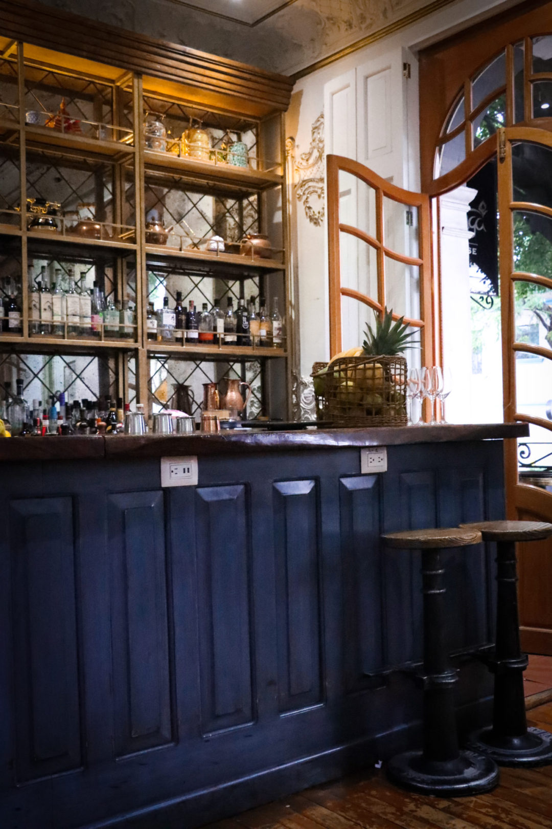 Where to drink the best natural wine: Galanga Thai Restaurant's blue and white bar area in Mexico City