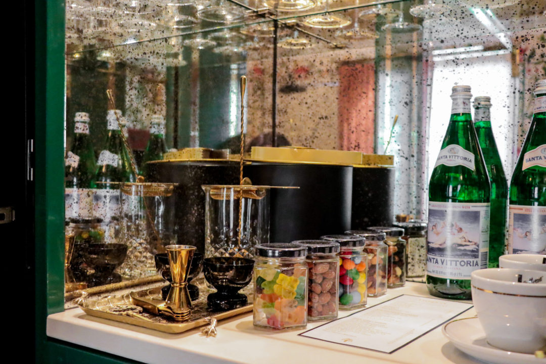 The coffee maker, cocktail-making accessories, European bottled water and candies inside an in-room bar at The Prospect Hollywood