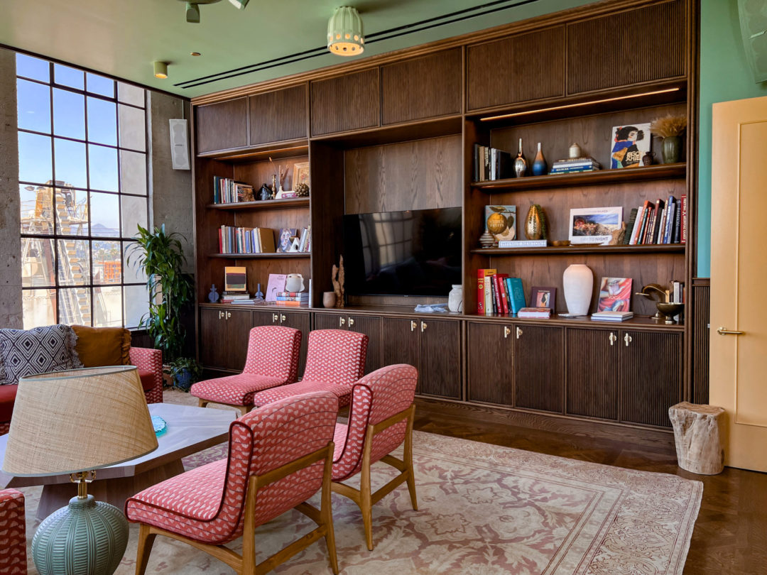 A group of four pink patterned chairs surrounding a coffee table inside one of the private coworking rooms inside Heimat Club in Los Angeles, California