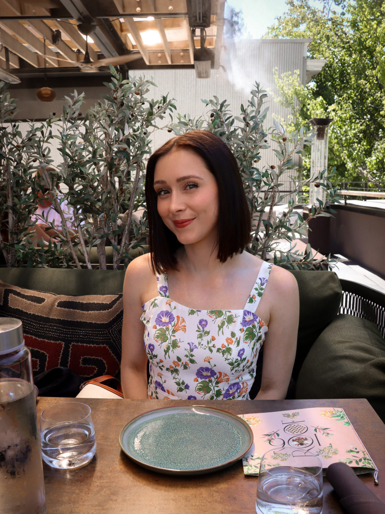 Travel Blogger Jordan Gassner sitting at a table at Roof 106 Rooftop Restaurant in Healdsburg, California
