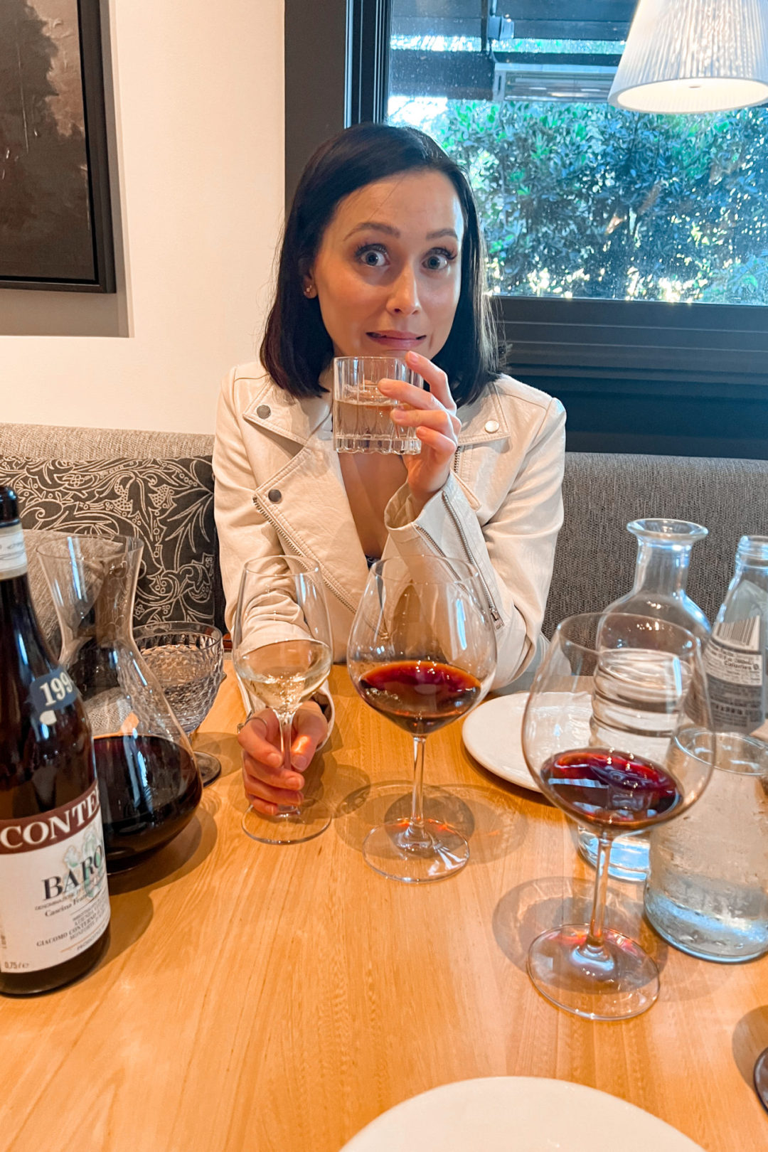 Travel Blogger Jordan Gassner drinking wine at Michael Mina's Wit + Wisdom in Sonoma, California