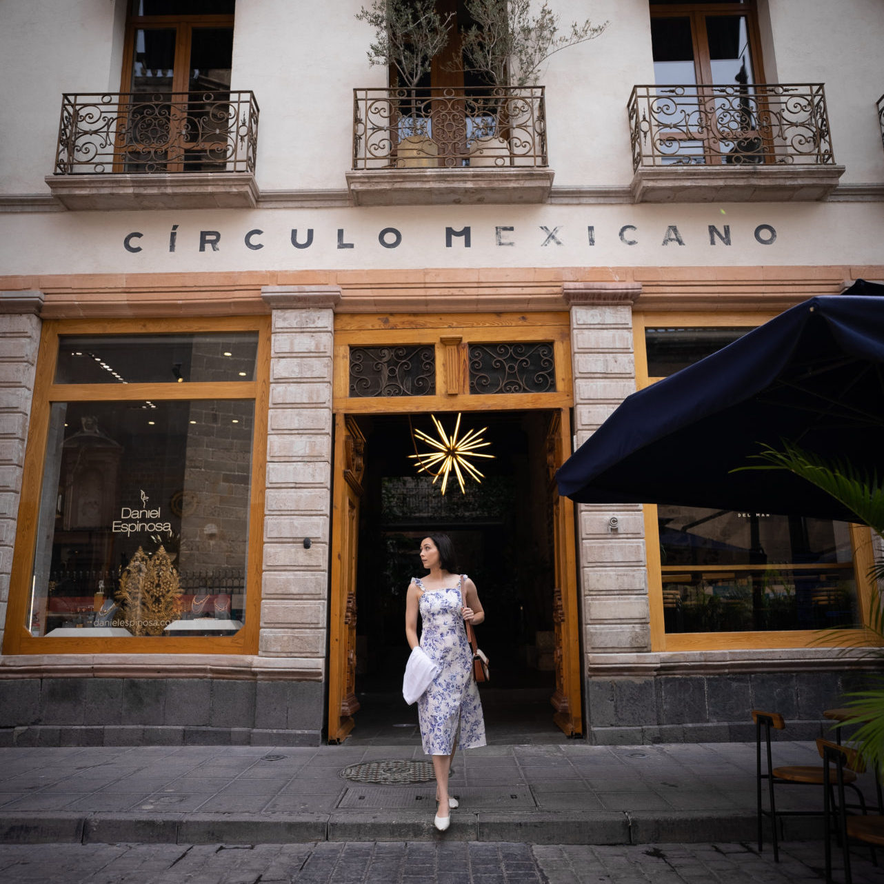 Travel Blogger Jordan Gassner walking out of the main entrance of the Círculo Mexicano Boutique hotel in El Centro, CDMX, Mexico