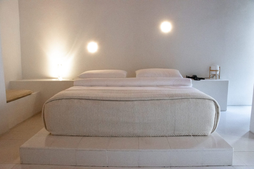 A bed inside a Junior Suite at the Círculo Mexicano Boutique hotel in Mexico City