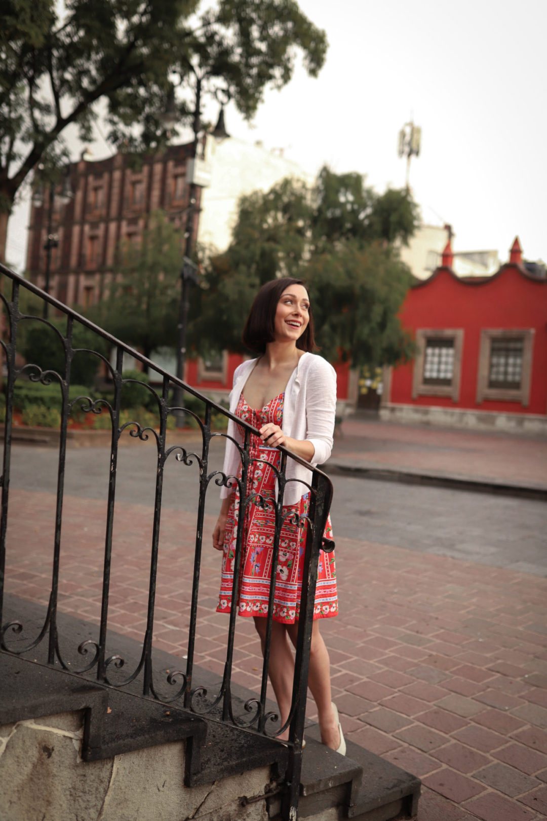 Travel Blogger Jordan Gassner climbing the kiosk in Jardín Centenario in Coyoacán Mexico City