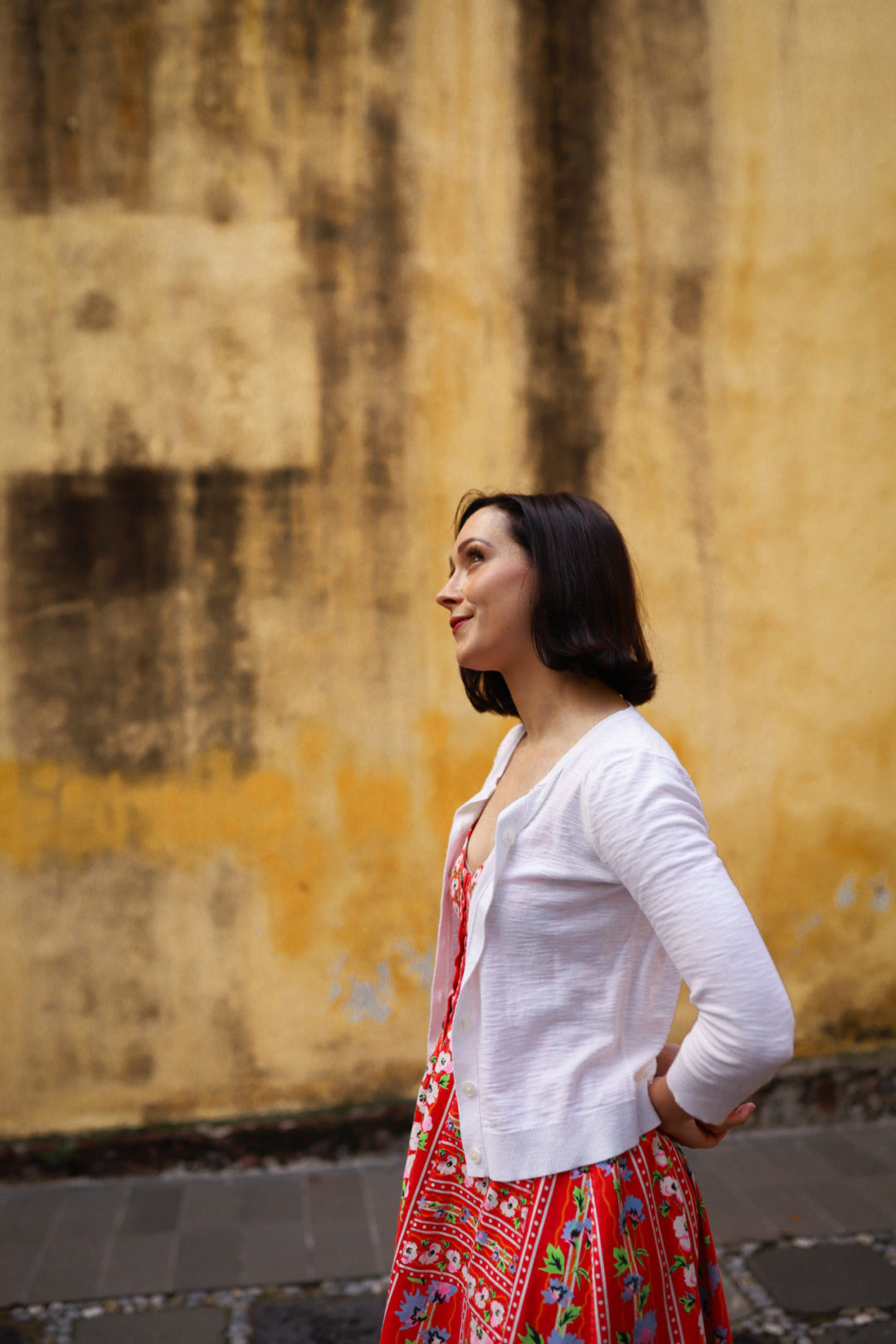 Travel Blogger Jordan Gassner glancing upwards and starting to smile near Capilla de La Conchita in Coyoacán Mexico City