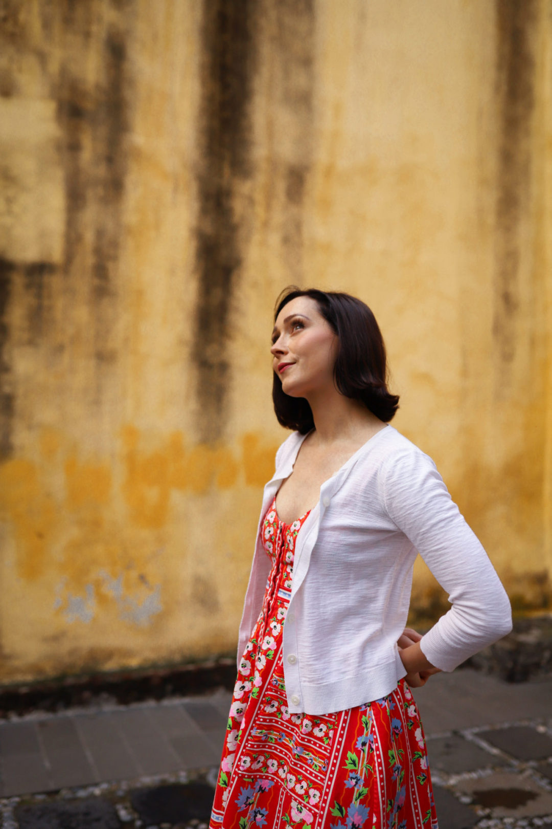 Travel Blogger Jordan Gassner glancing upwards near Capilla de La Conchita in Coyoacán Mexico City