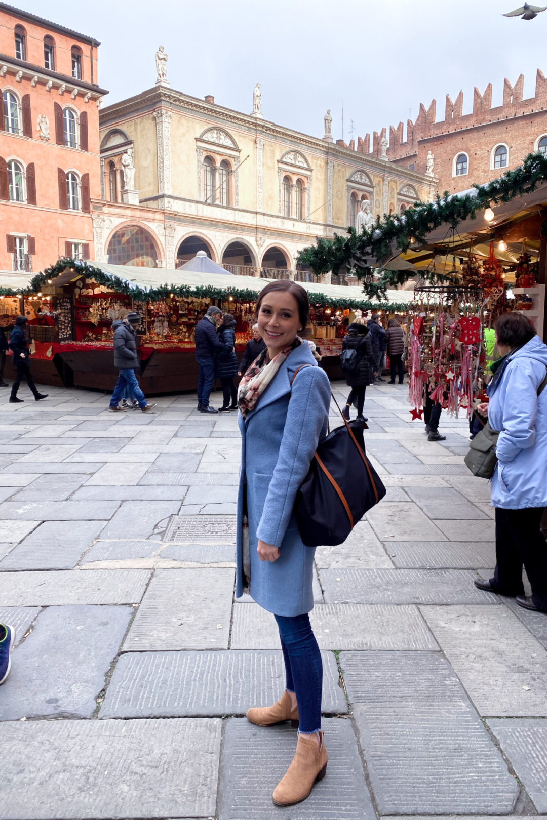 Travel Blogger Jordan Gassner at a traditional European Christmas Market in Verona, Northern Italy