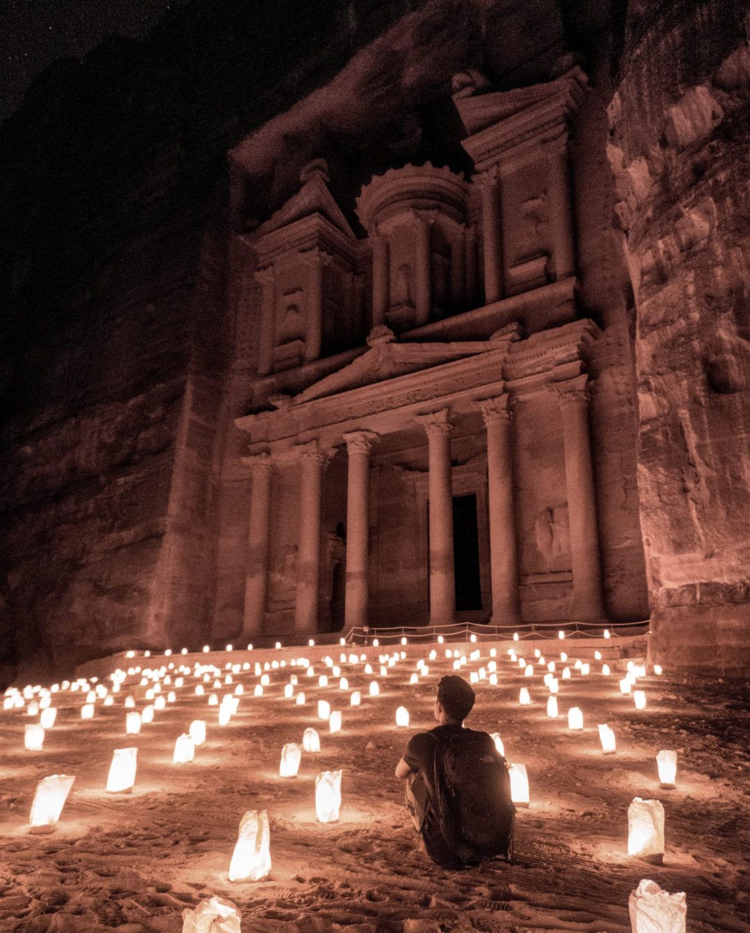 The Treasury at Petra illuminated by paper bags filled with candles under the cover of night in Jordan