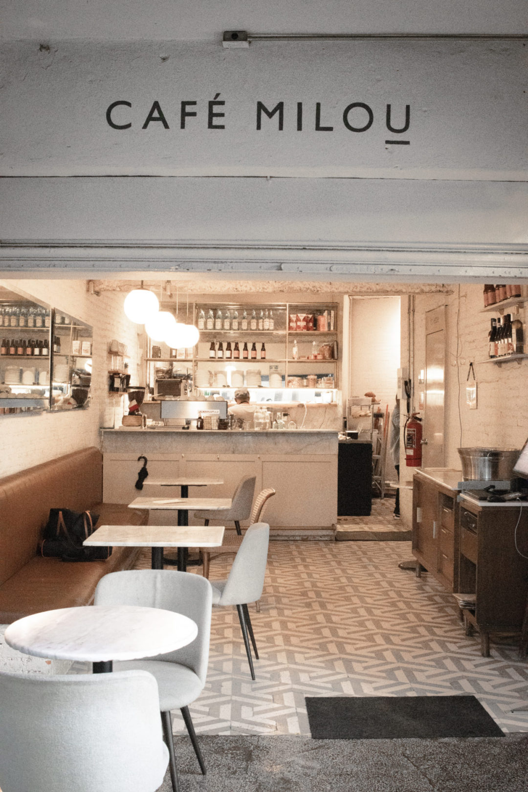 A small, beautiful cafe with a sign reading "Café Milou": a great restaurant for eating dairy-free in Mexico City