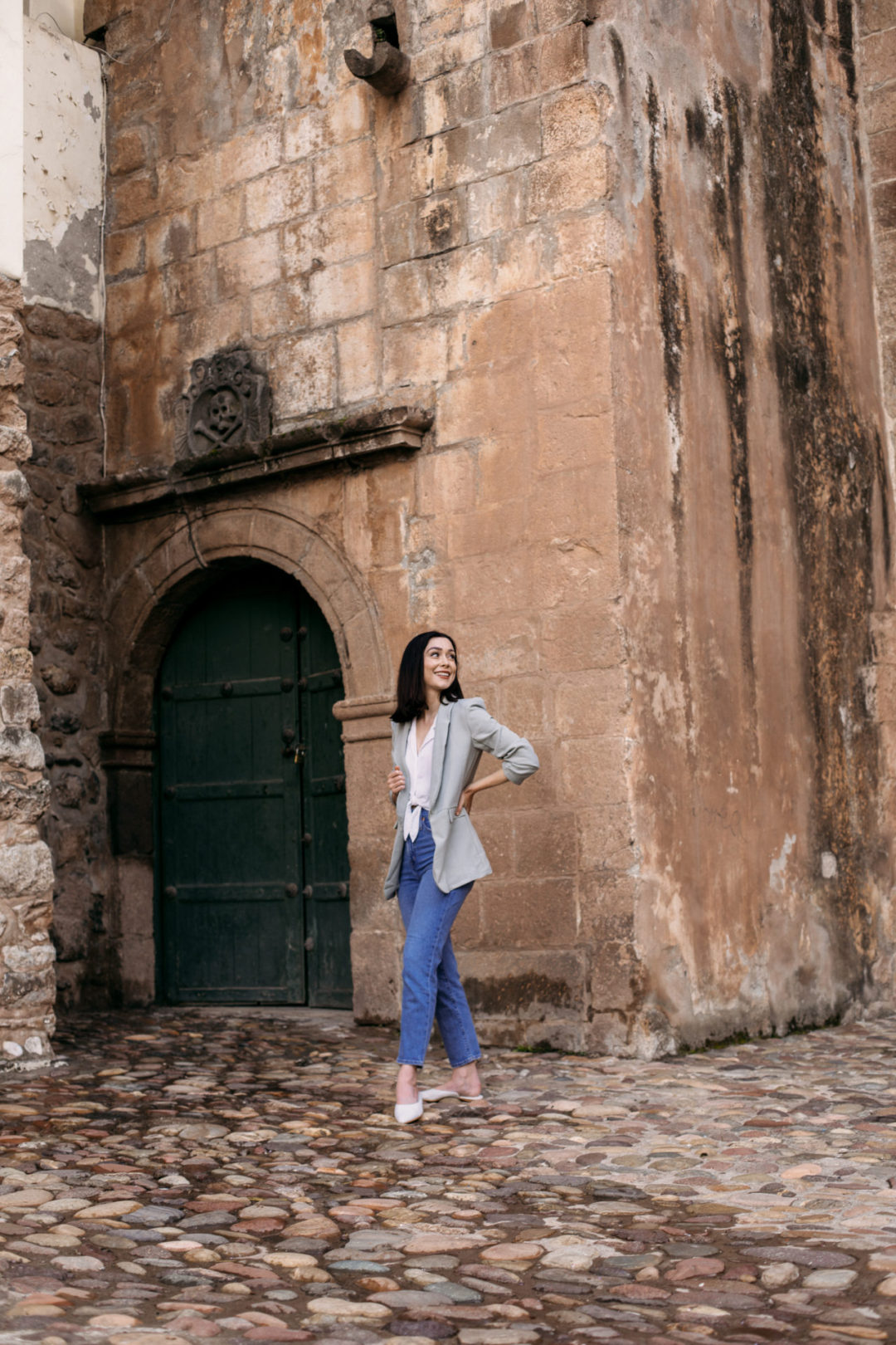 Travel Blogger Jordan Gassner standing near an entrance to the Cusco Cathedral in Cusco's Plaza De Armas