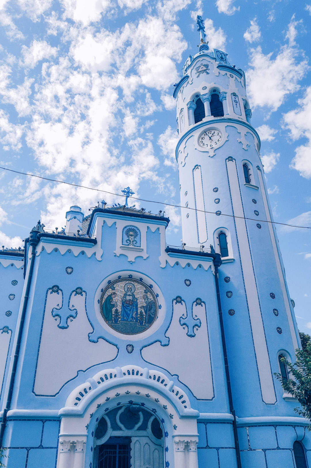 Bratislava Travel Guide: the sky blue St. Elizabeth's Church in Old Town blends in with the sky on a mellow spring day