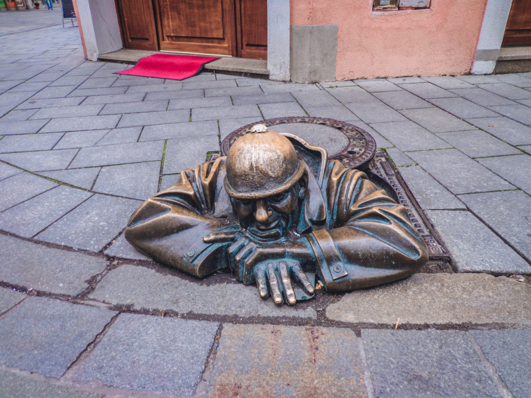 Bratislava Travel Guide: the famous Čumil, "Man at Work", statue in Old Town