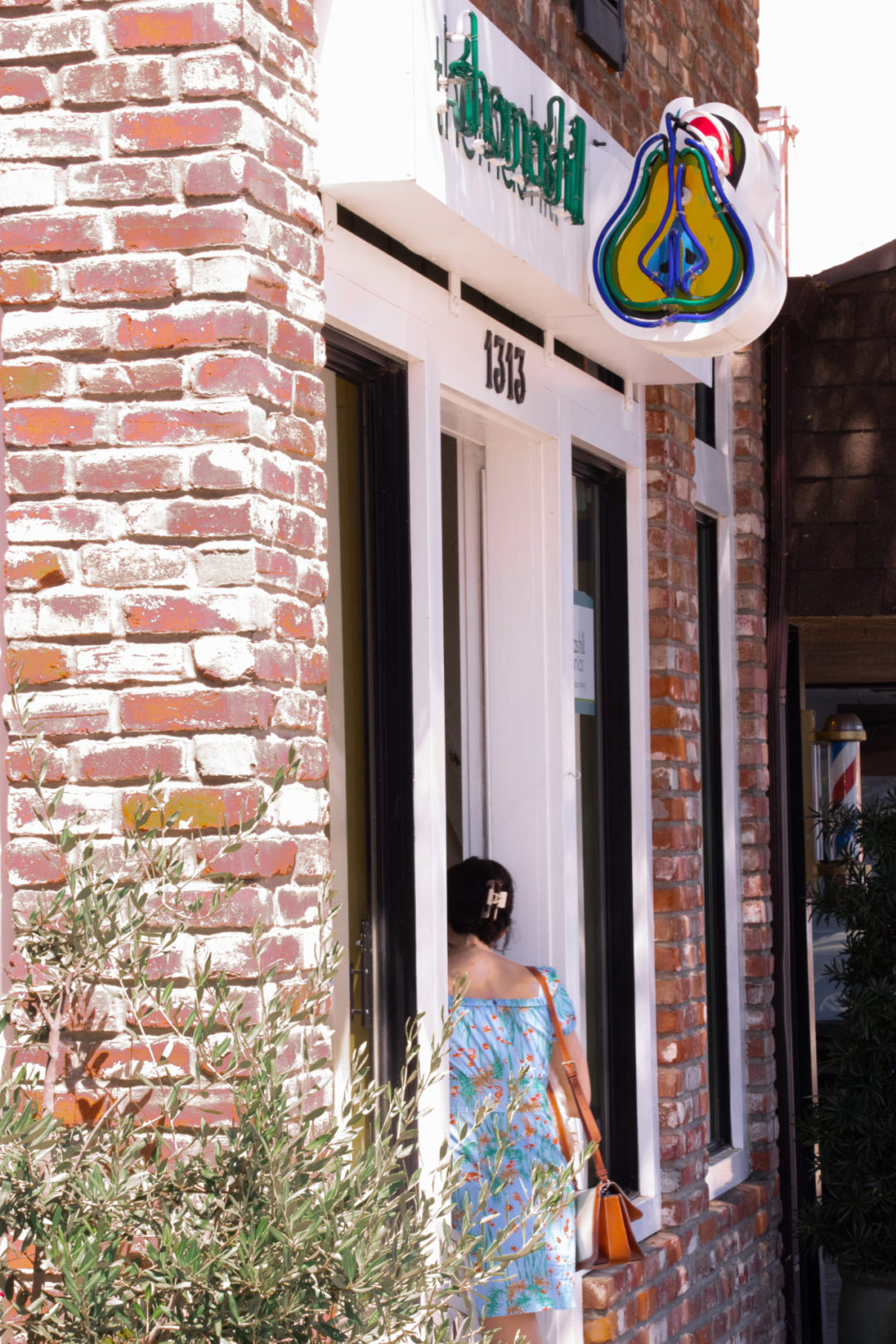 Travel Blogger Jordan Gassner walking inside Thomas Hill Organics Bistro and Wine Bar in Paso Robles, California