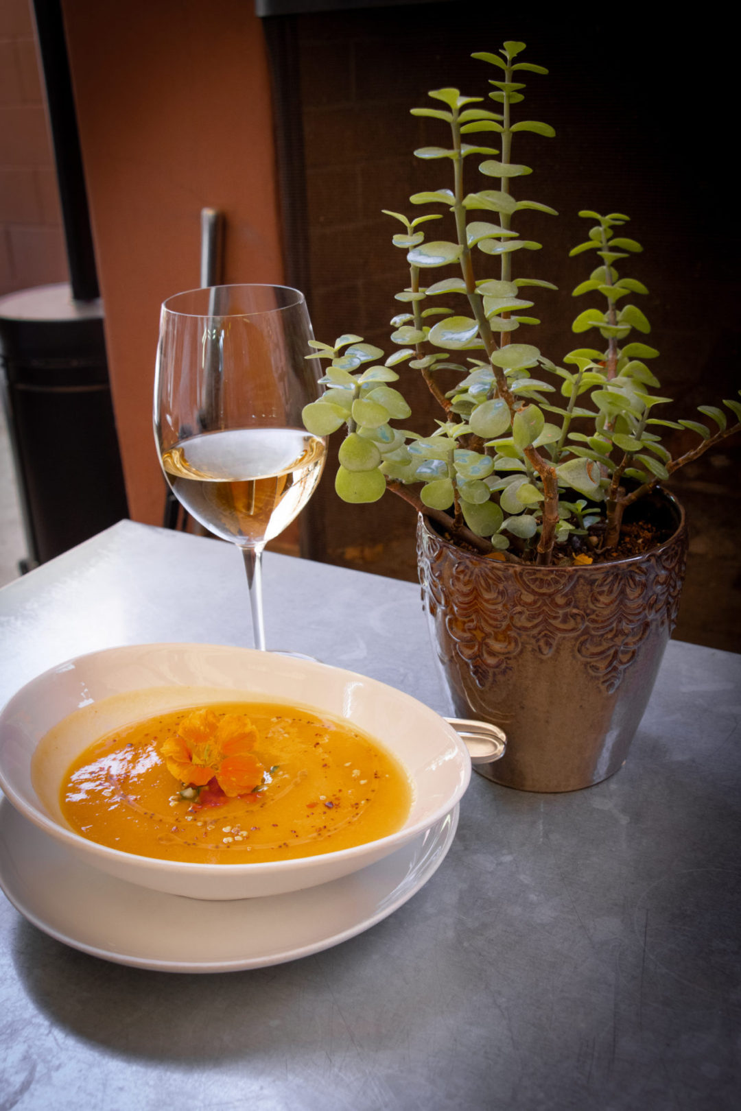 Gazpacho and a Glass of White Wine on a Table at Thomas Hill Organics Bistro and Wine Bar in Paso Robles, California