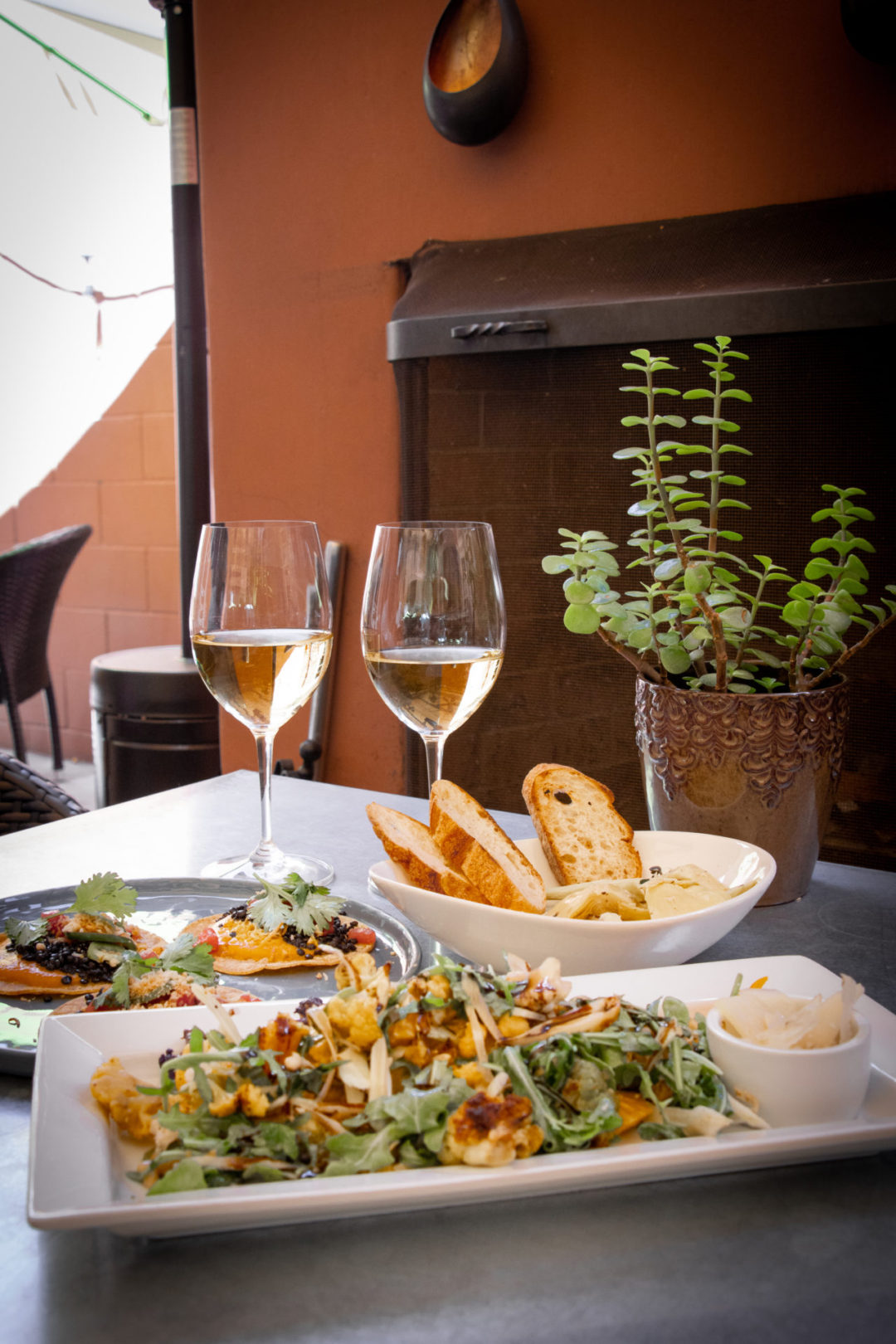 A salad and two glasses of wine from Thomas Hill Organics Bistro and Wine Bar in Paso Robles, California