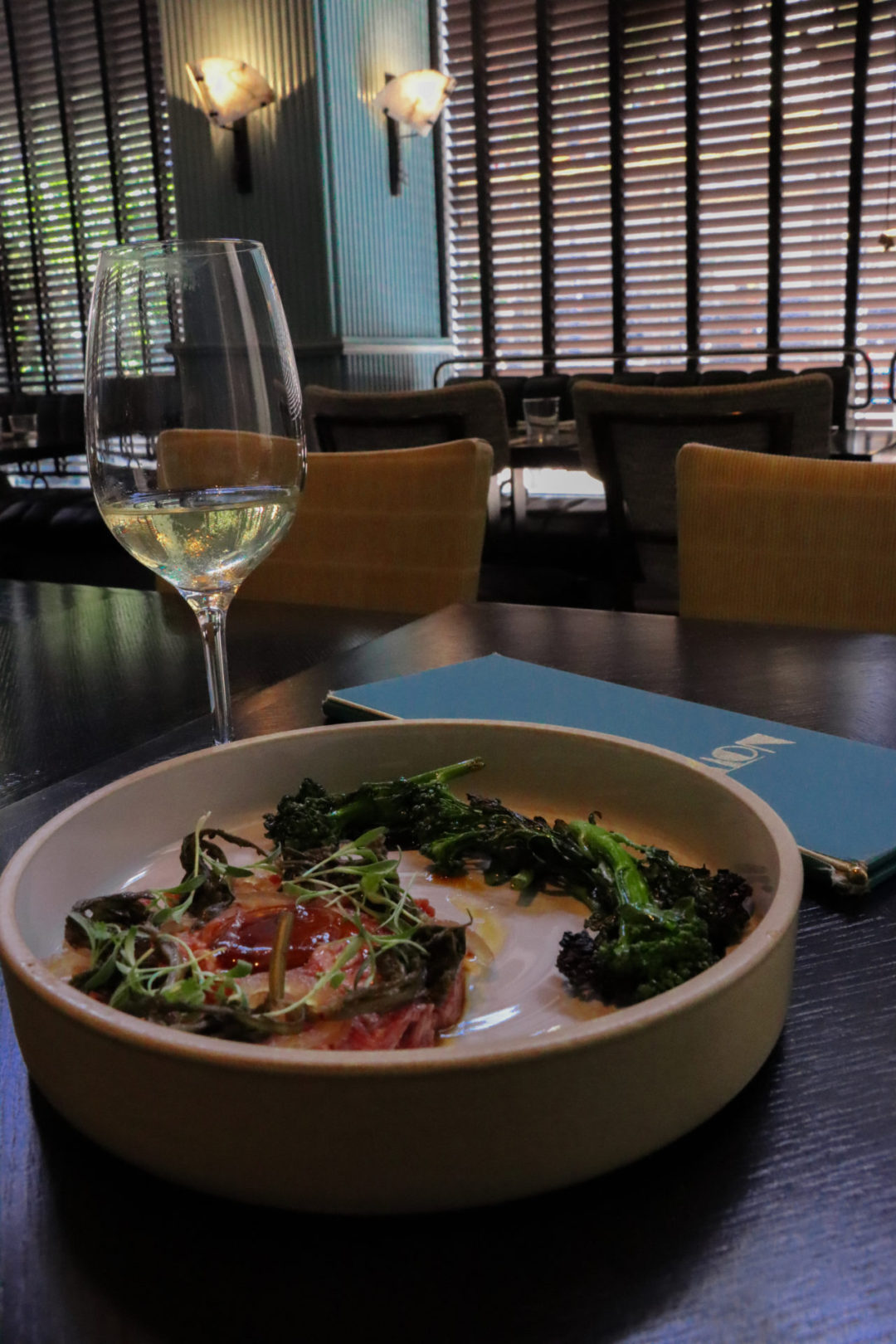 A glass of white wine and the beef tartare from Villon Restaurant in San Francisco, California