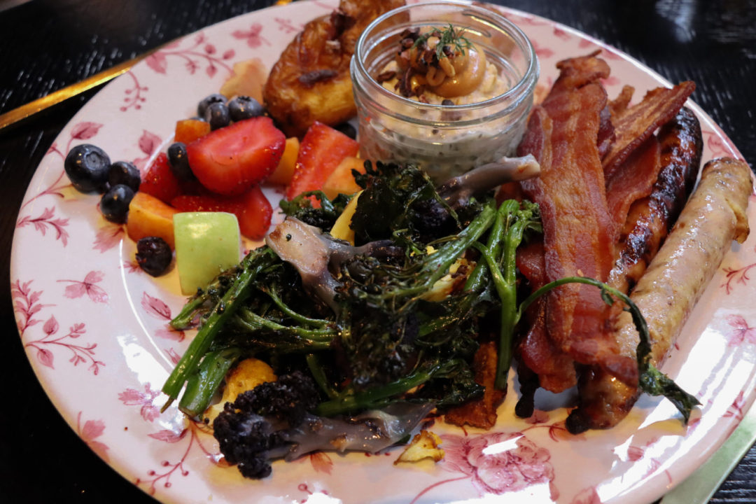 A Red and White floral plate filled with items from the San Francisco Proper Hotel's Breakfast Buffet Station