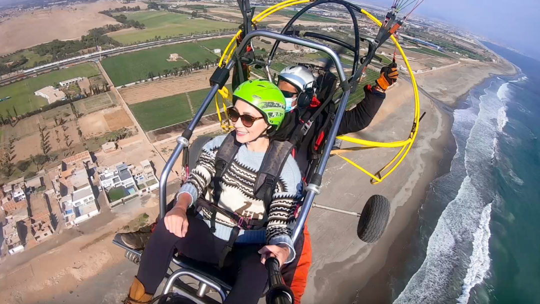 Travel Blogger Jordan Gassner paragliding over a Peruvian beach just south of Lima on Christmas Eve 2021