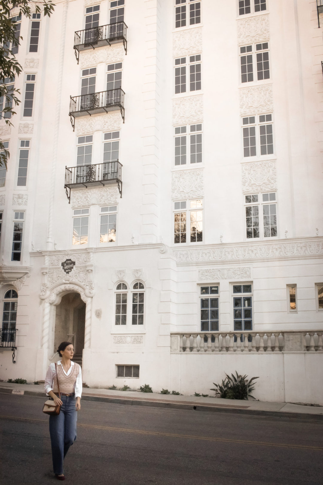 Travel Blogger Jordan Gassner walking by El Mirador on Sweetzer Avenue in West Hollywood, California