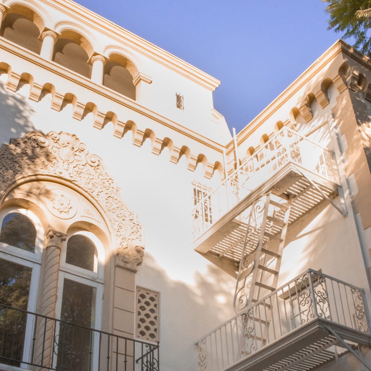 The vintage fire escape and Churrigueresque and Spanish Colonial Revival details on West Hollywood's Romanesque Villa 
