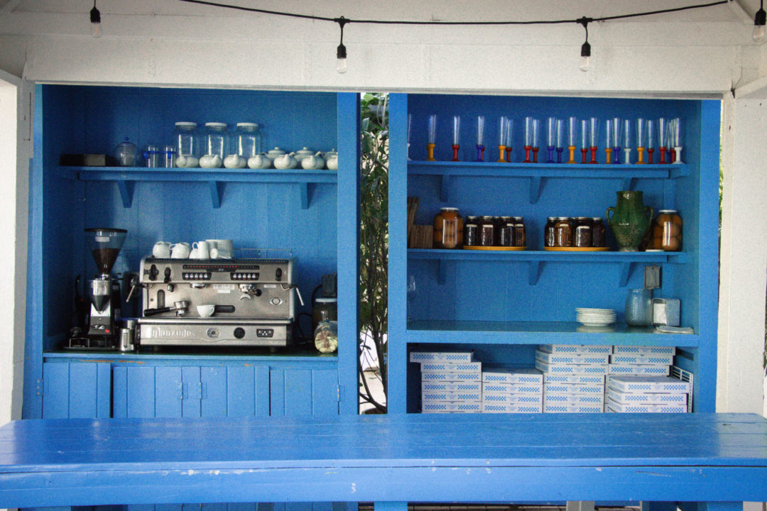 A blue and white coffee and boxing station setup at Paradise Pizza inside the Palm Heights Hotel in Cayman Islands