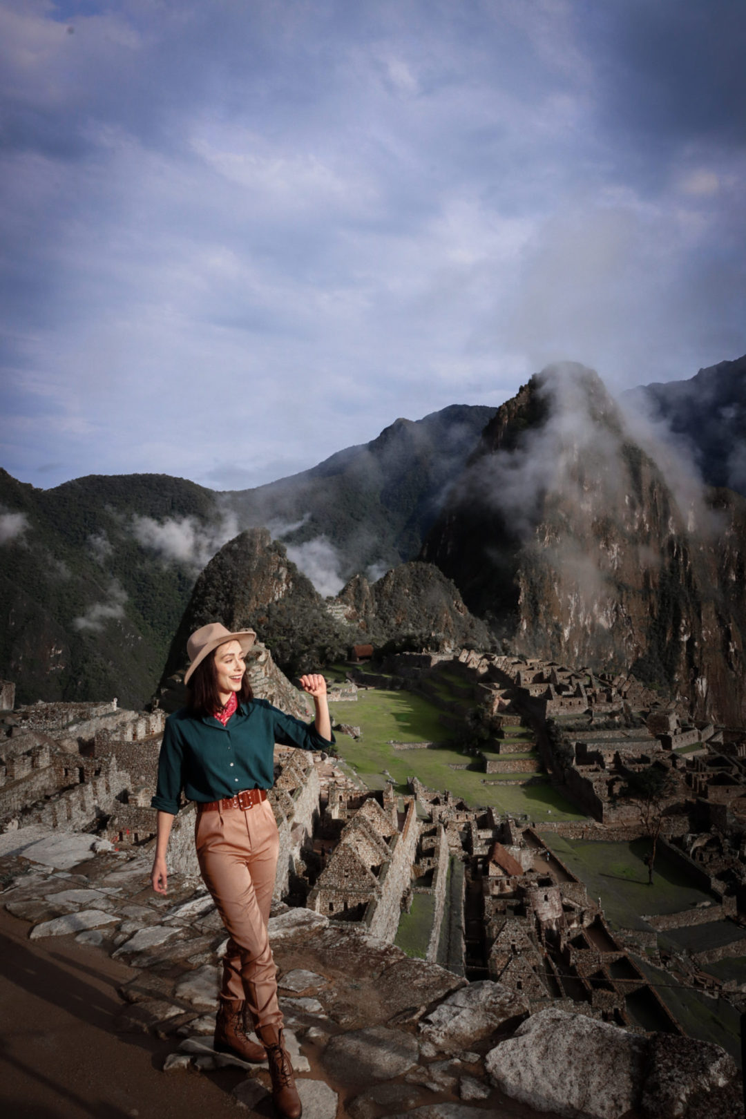 Machu Picchu By Train: Travel Blogger Jordan Gassner smiling on top of the lower terrace in Machu Picchu, Peru