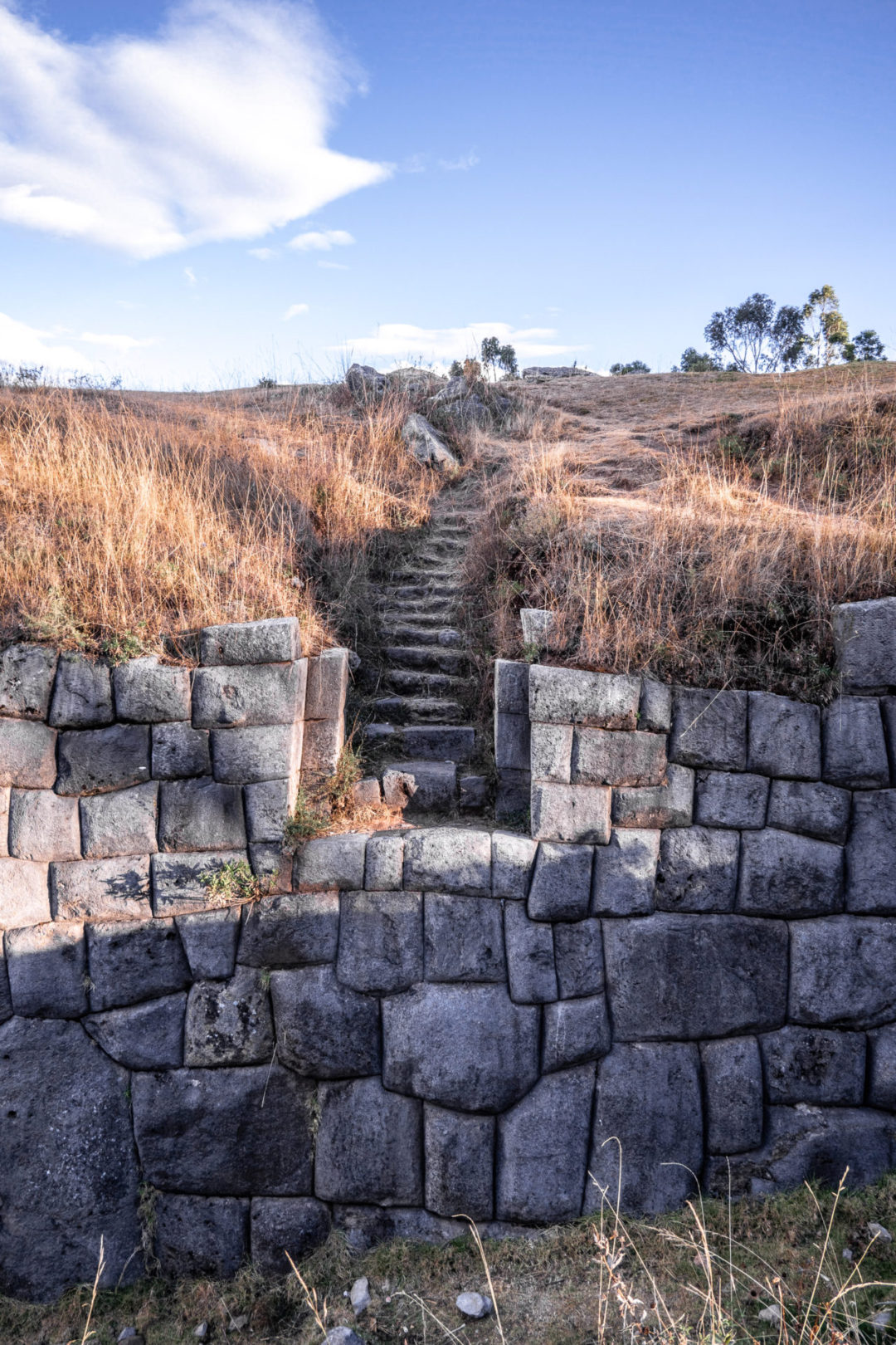 A view of one of the Inca walls leading up to a set of stairs at the archeological site of Qenqo near Cusco, Peru