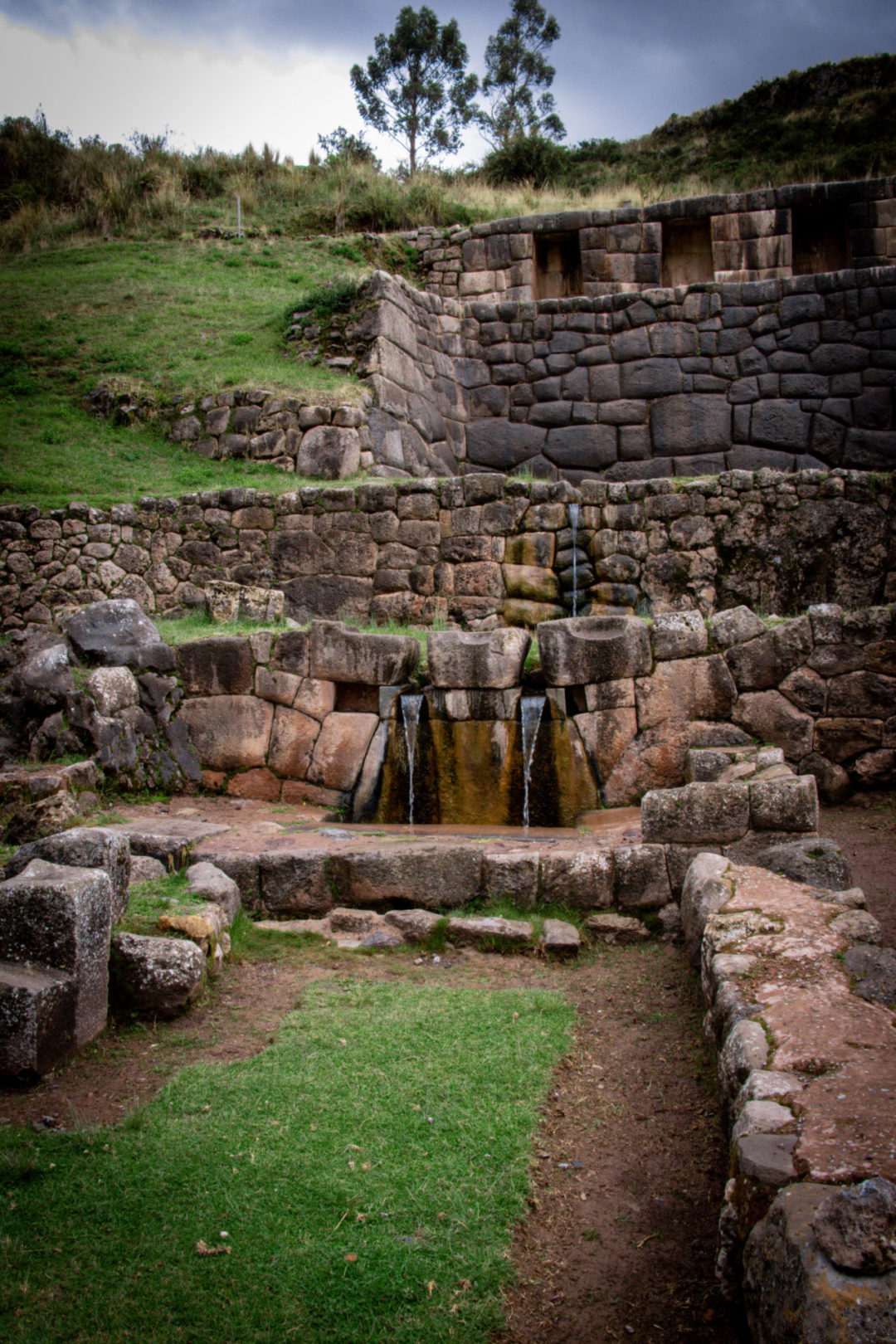 Water flowing down the series of aquaducts, canals and waterfalls in the Inca ruins of Tambomachay near Cusco, Peru