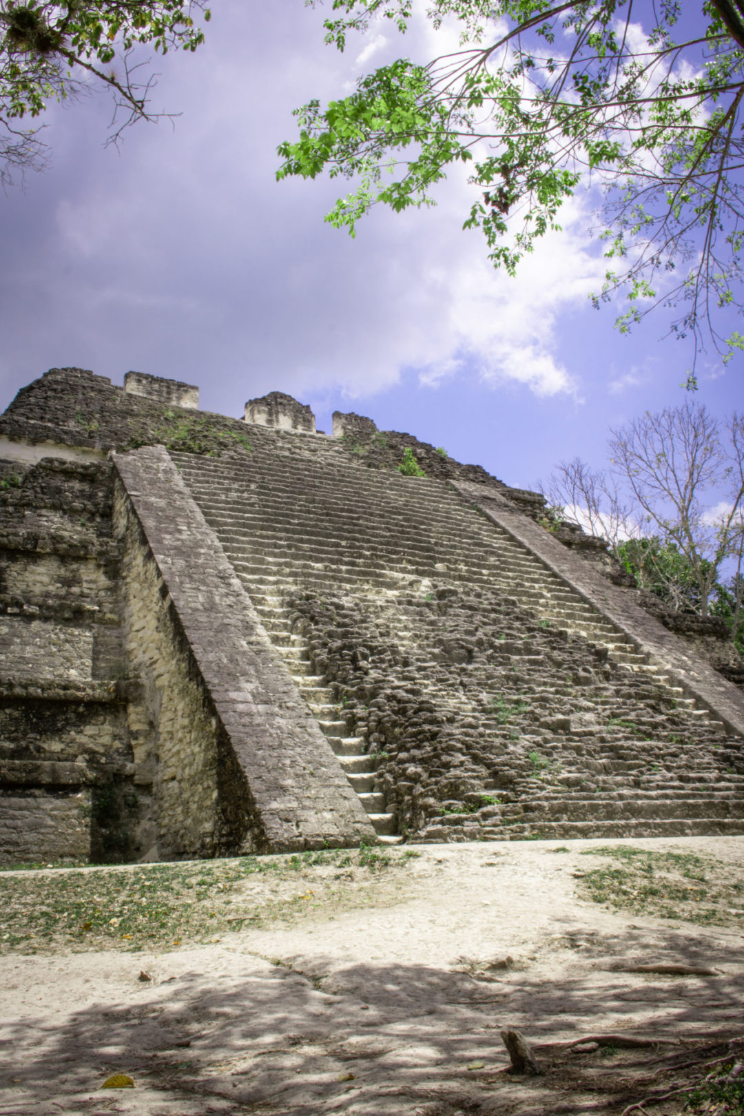 A destoryed set of stairs leading up a Mayan pyramid inside Tikal in Guatemala 