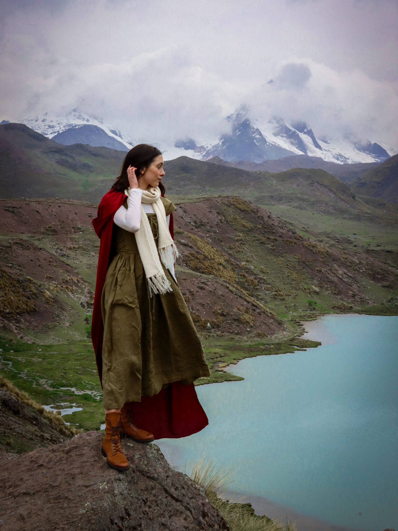 Travel Blogger Jordan Gassner overlooking an alpine lake along the Ausangate 7 Lakes Trail located about 3 hours from Cusco, Peru