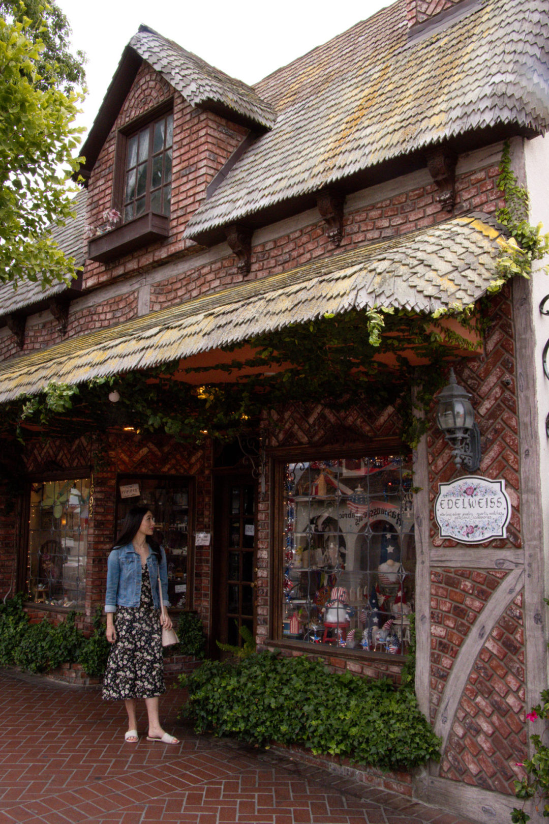 Travel Blogger Jordan Gassner standing in front of the Edelweiss Store on Copenhagen Drive in Solvang, California